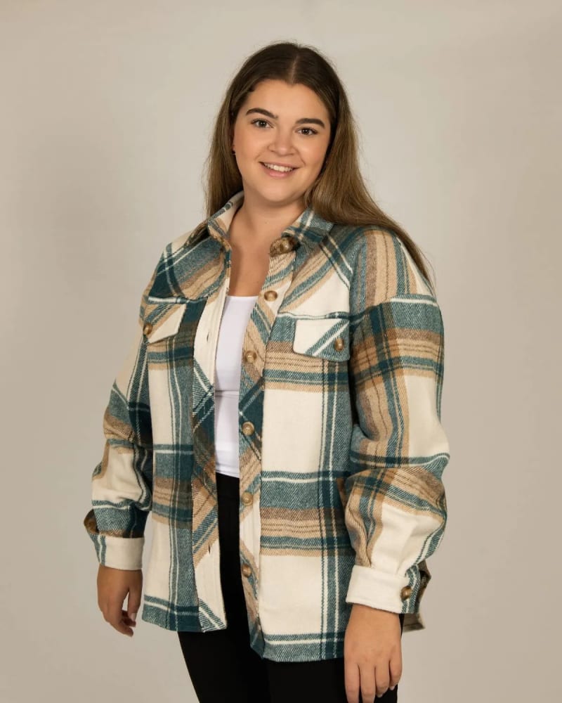 Side of a model wearing a size XL/1X Mackenzy Shacket Plaid Jacket Teal in Teal by ANNICK. | dia_product_style_image_id:317358
